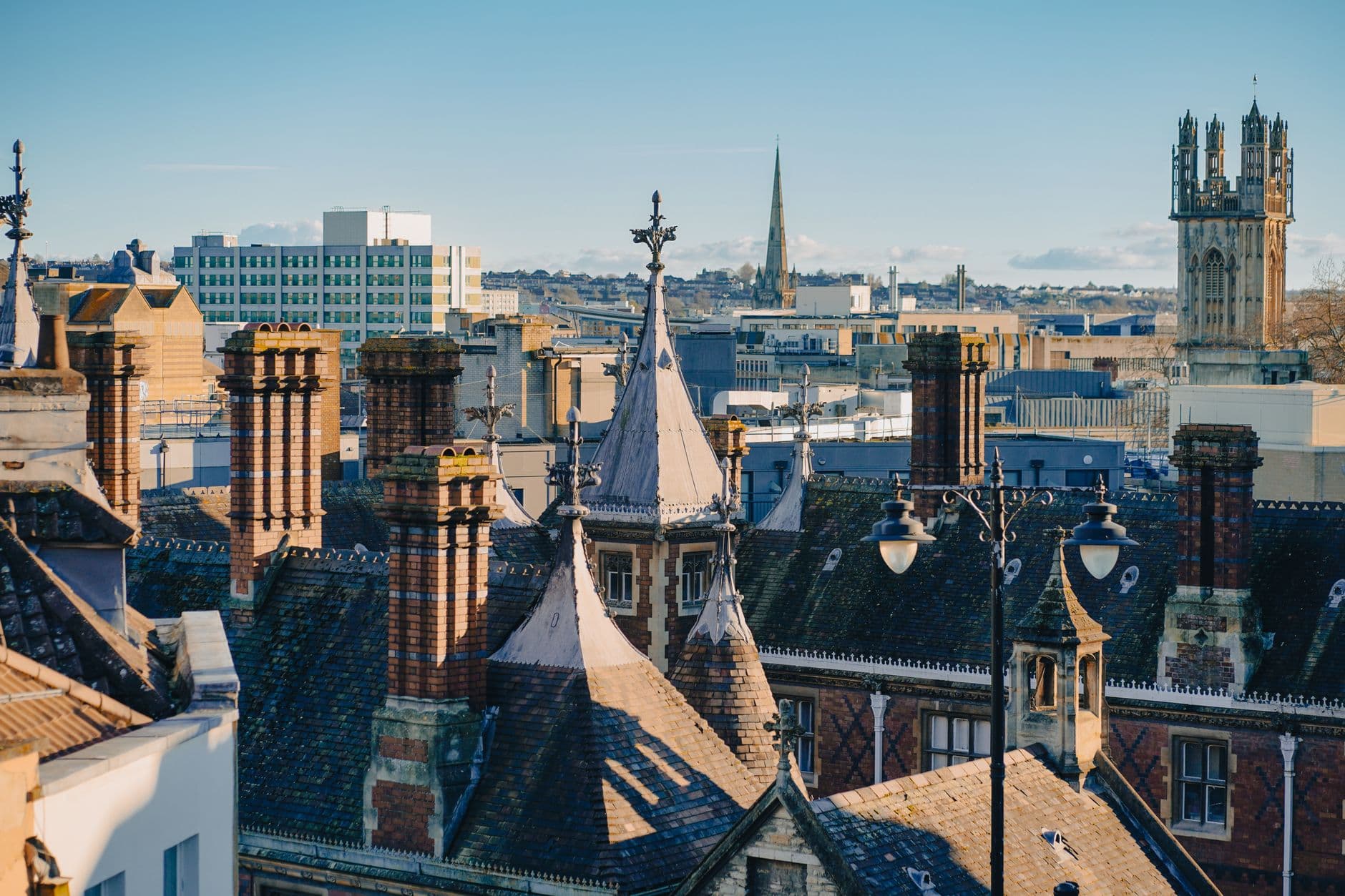 Charming aerial view of urban rooftops with architectural detailing, capturing the essence of a historical townscape.